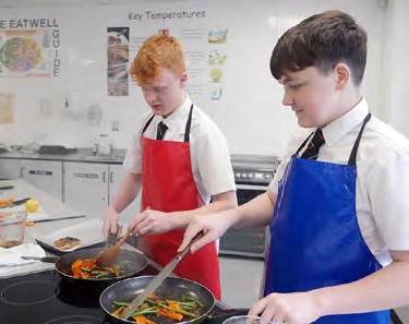 2 Students Cooking at the beacon academy