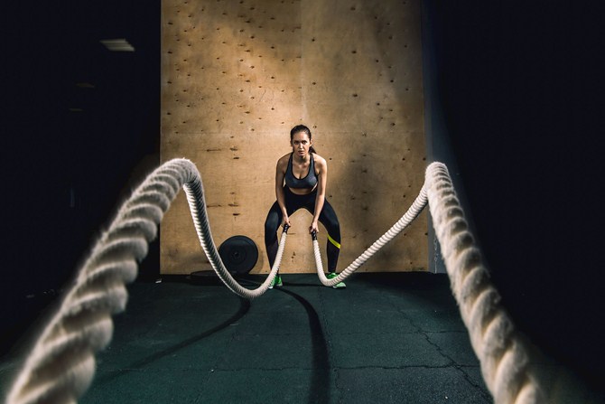 Woman Exercising with ropes